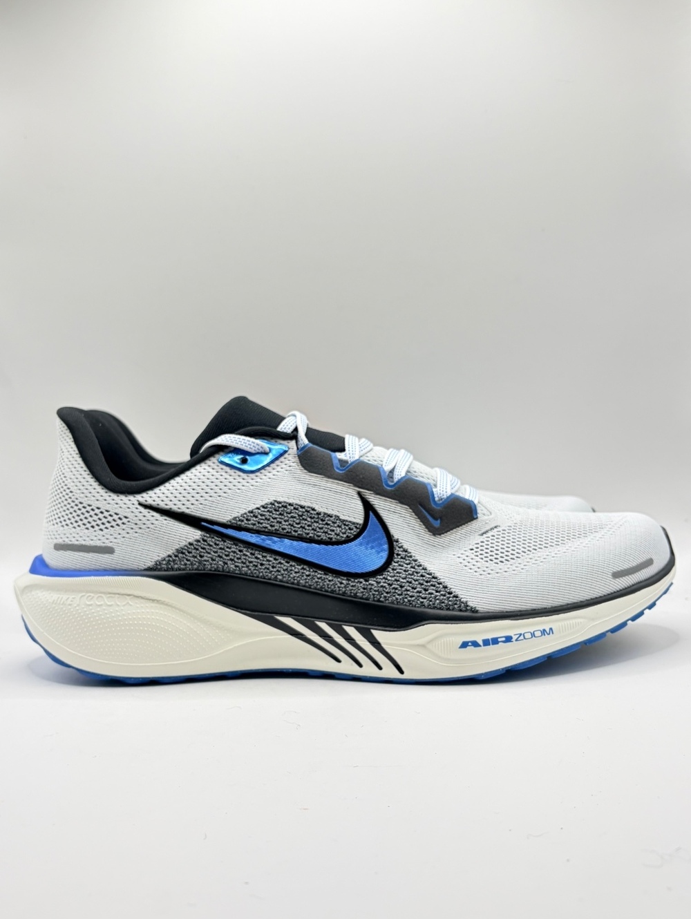 Nike Air Zoom Pegasus 41 in White, Photo Blue, Black and Sail, men’s size 11.